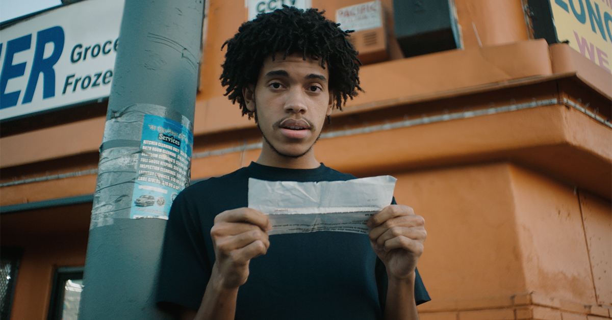 Young black man reading tobacco industry quote