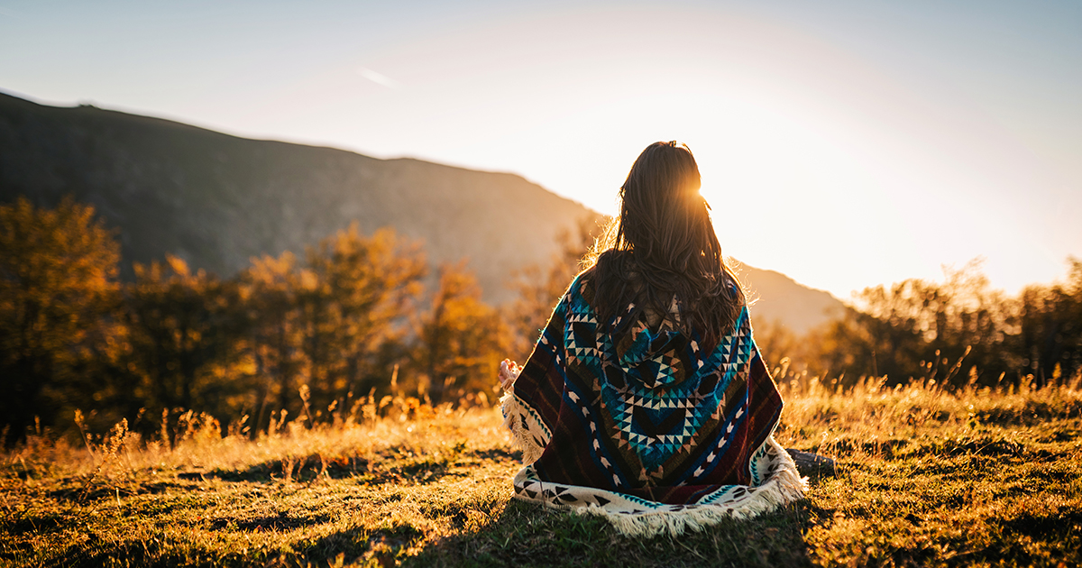 Woman watching sunset